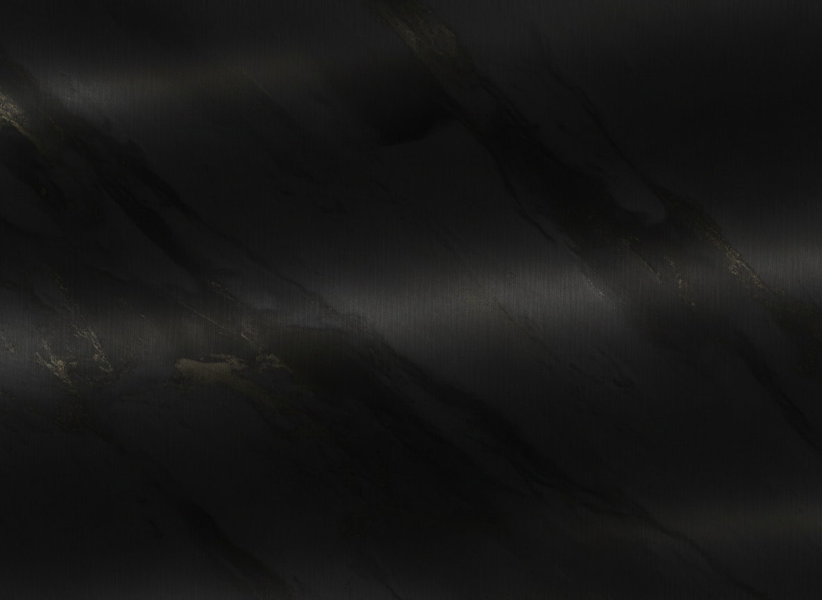 Close-up of a dark brushed-metal surface catching a faint, restrained sheen of light